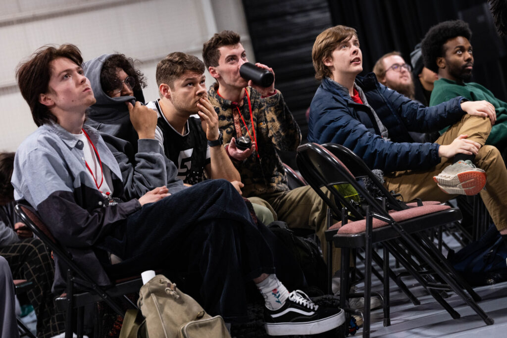 A crowd intently watches a set at Afterburner 2025.